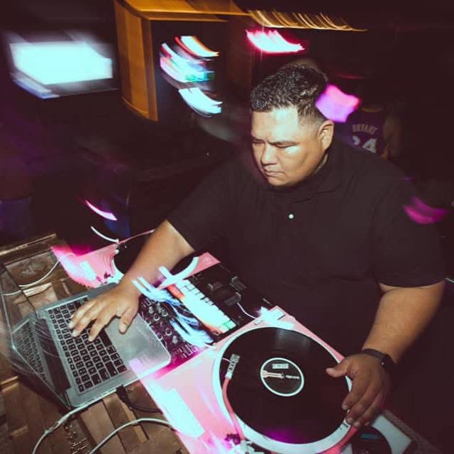 DJ John Styles scratching vinyl at club event